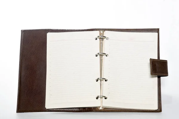 Notebook with leather cover, notepad on white background with space for text
