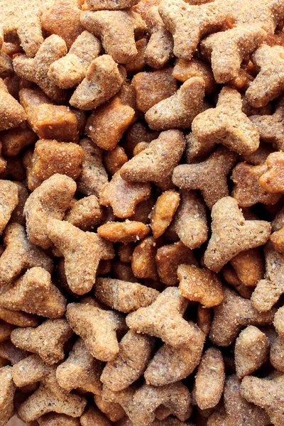 pet food croquettes of different sizes. soft selective focus, blur