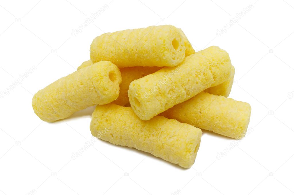 Handful of sweet crunchy corn sticks, snacks isolated on white background.