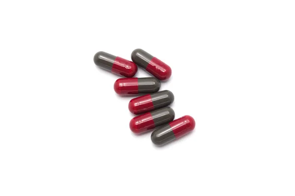 Medicamentos Recetados Cápsulas Colores Rojo Gris Oscuro Mezclados Sobre Fondo —  Fotos de Stock