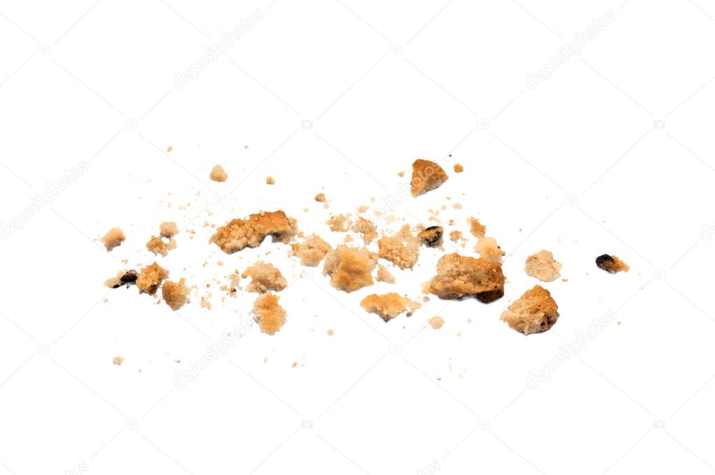 Scattered crumbs of chocolate chip cookies isolated on white background. Sweet biscuits delicious and crunchy homemade pastry.