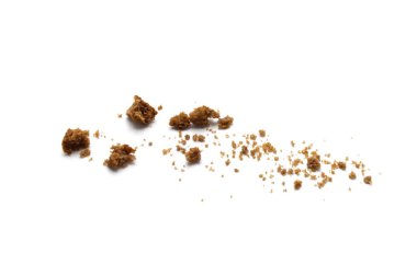 Scattered crumbs of chocolate chip butter cookies on white background. clipart