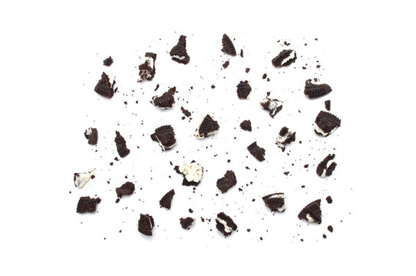 Oreo Biscuits with crumbs  isolated on white background. It is a sandwich cookies filled with chocolate cream flavored. The best selling dessert in Thailand.