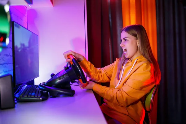 Girl Gamer Playing Racing Computer She Uses Steering Wheel Emotional — Stock Photo, Image