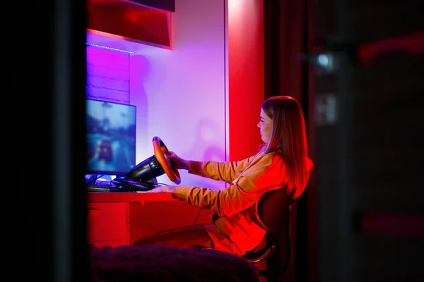 Girl Gamer Playing Racing Computer She Uses Steering Wheel Emotional — Stock Photo, Image
