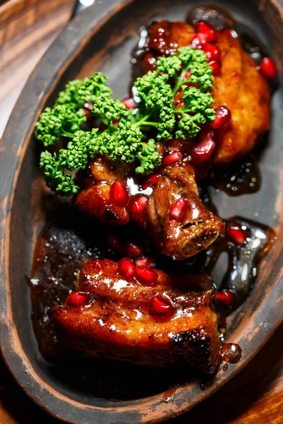 Baked ribs with pomegranate sauce. Original dish from the chef