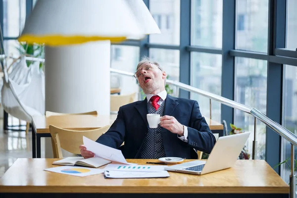 Male Businessman Sits Cup Coffee Makes New Project Grimaces His — Stock Photo, Image
