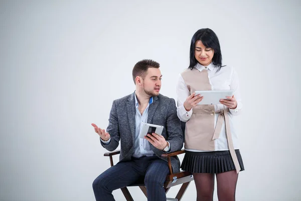 Successful Man Suit Sits Black Chair Woman Stands Next Look — Stock Photo, Image