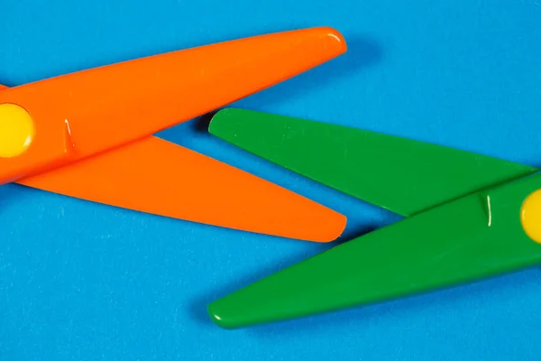 Children Plastic Scissors Cutting Paper Figures Colored Background — Stock Photo, Image