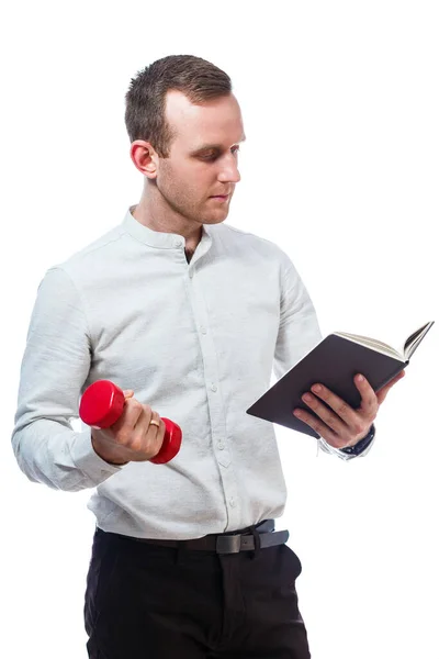 Caucasian man businessman, a teacher mentor. He is holding a diary and red dumbbell. He is wearing a shirt. Emotional portrait. Isolated on white background — Stock Image Caucasian Man Businessman Teacher Mentor Holding Diary Red Dumbbell Wearing Royalty Free Stock Photos