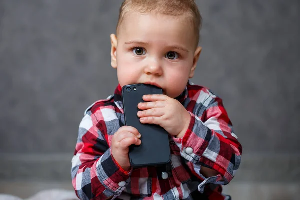 Little Boy Shirt Gnaws Mobile Phone Royalty Free Stock Images