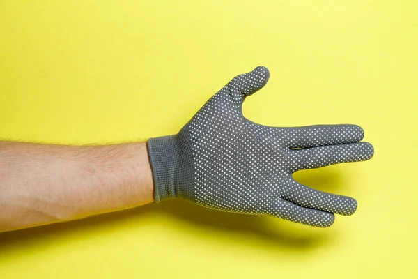 Hand Man Craftsman Gardener Gray Glove Yellow Background — Stock Photo, Image