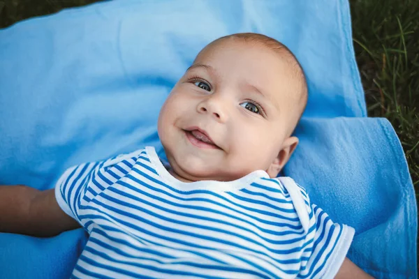 Little Boy Months Lies His Back Blue Bedspread Park Green — Stock Photo, Image