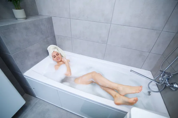 Girl Woman White Towel Her Head Lies Bathroom White Bath — Stock Photo, Image