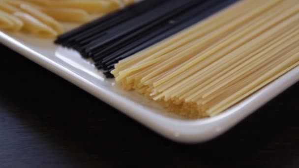 Various types of dry pasta.close-up.macro.the camera flies over this ahead — ストック動画