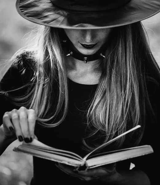 Witch reading a book — Stock Photo, Image