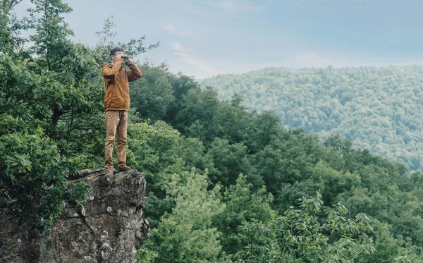 Explorer looking in binoculars — Stock Photo, Image