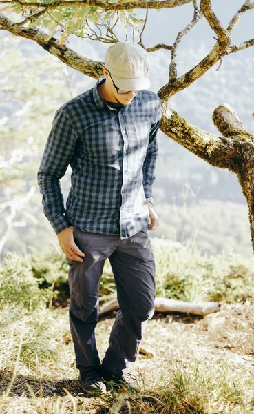 Explorer man walking in pine woods. — Stock Photo, Image