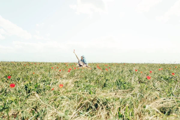 Happy young woman resting on flower meadow. — Stock Photo, Image