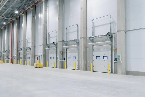 Gate in Large modern empty storehouse, nobody Stok Fotoğraf