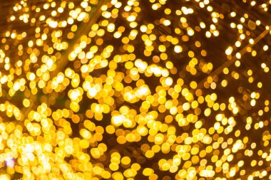 Sarı renkli ışık noel ağacının soyut dairesel bokeh 'i 