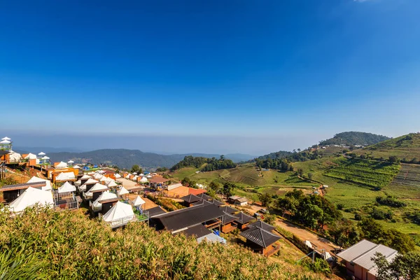 Beautiful view of White camping tents with Mon jam mountain land