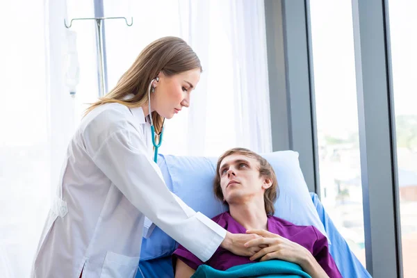 Female doctor with hands of checking examining his pulse to a ma — 스톡 사진