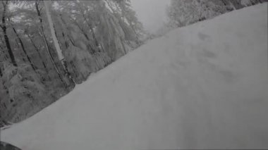 snowboarder slopes down hill.Shadow of snowboarder.