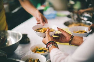 Feeding the poor to hands of a beggar, Poverty concept