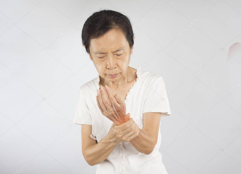 old asian woman feel wrist muscle injury