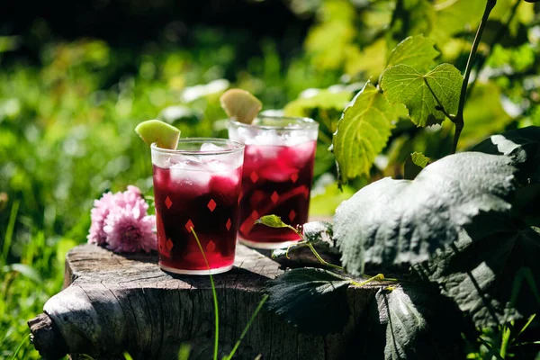 Cold refreshing sangria cocktail in the summer garden.