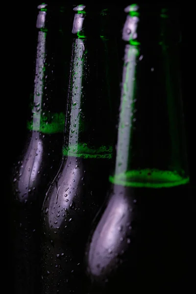 Three Misted Open Bottles Cold Beer Black Background — Stock Photo, Image