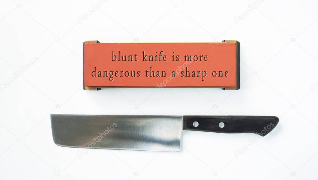 Japanese Nakiri knife and whetstone sharpener with quote Blunt Knife Is More Dangerous Than a Sharp One engraved in it