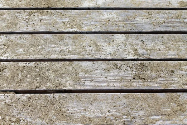 Zbliżenie na drewniane molo z piasku — Zdjęcie stockowe
