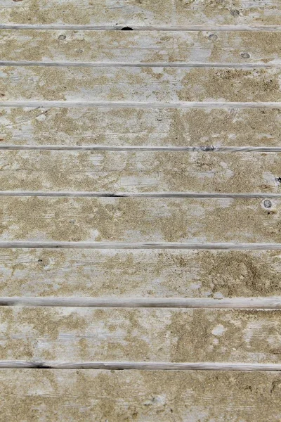 Närbild på träbryggan med sand — Stockfoto
