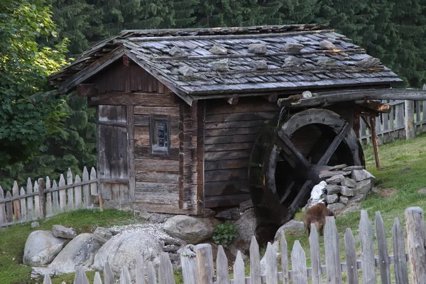 Ancient water mill on the Alps in Italy