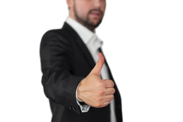 Takım elbiseli ve kravatlı işadamı baş parmağını gösteriyor.