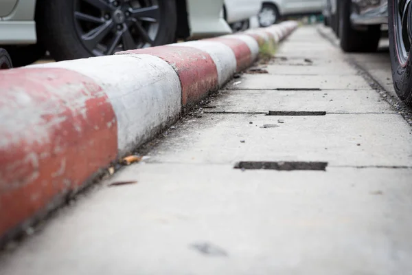 White and red stripes on the sidewalk — Stock Photo, Image