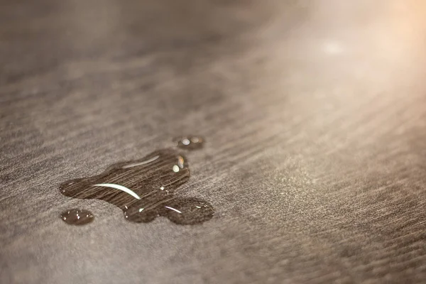 Water Drops On Wooden Table