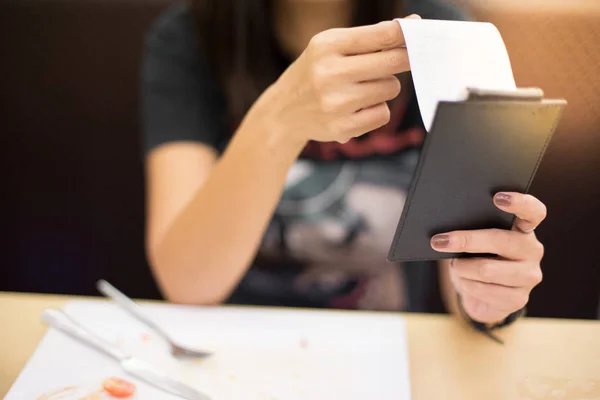 Women are reading food bill