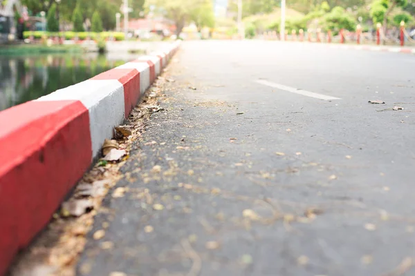 Selective focus of White and red stripes on the sidewalk — Stock Photo, Image