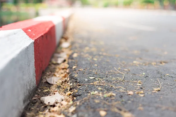 Selective focus of White and red stripes on the sidewalk — Stock Photo, Image