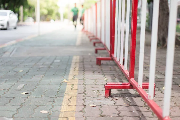 Selective focus of Barricade on sidewalk with sunlight — Stock Photo, Image