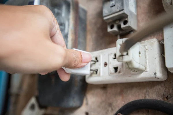 Close up of Hand plugged in