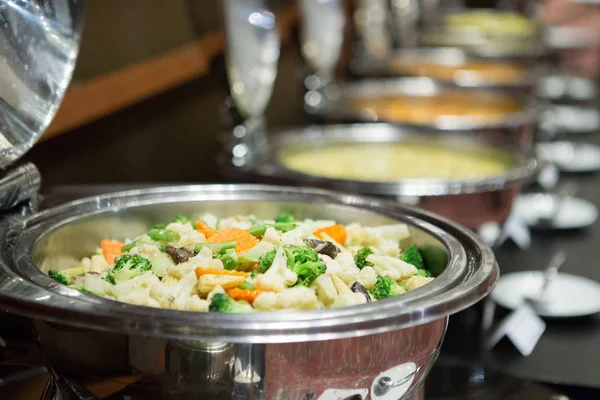 Chafing dishes on the table at the luxury banquet