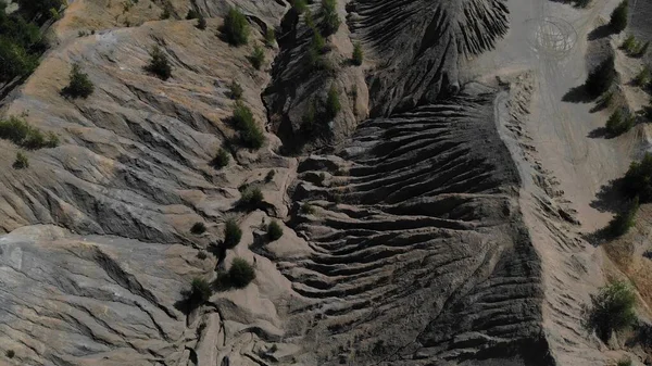 Aerial footage of gray mountains and ravine. Great top view on a canyon with gray mountains. Another planet footage