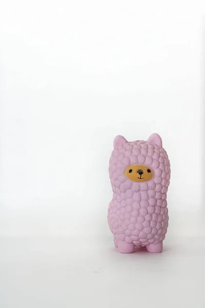Pink small llama squishy on white empty background. Vertical with copy space. Isolate. Soft toy for kids, antistress. — Stock Photo, Image