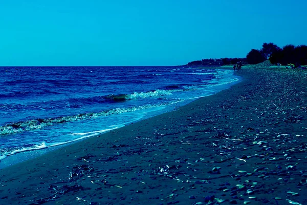 Beach view. Seashore texture. line water foam over clean sand and water. Hirozontal. Classic, blue monochrome, trend 2020