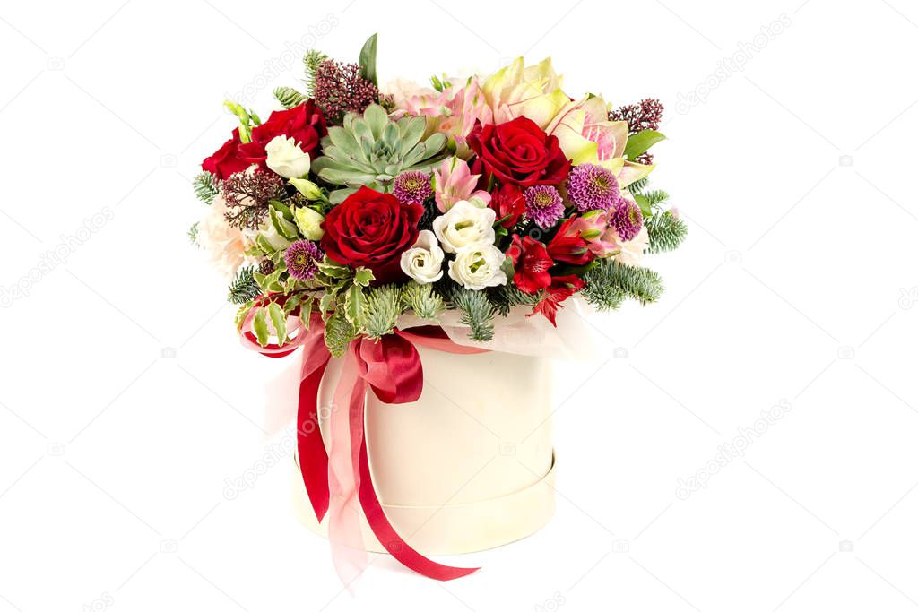 floral fresh arrangement of bright flowers in a hat box copy space white background