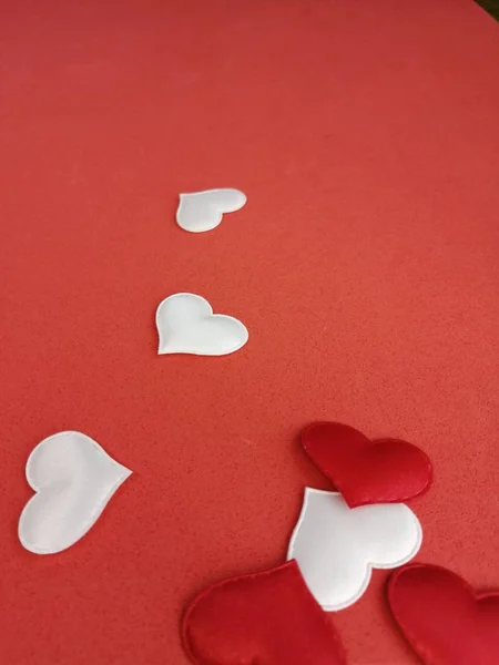 festive beautiful romantic hearts laid out on a red background